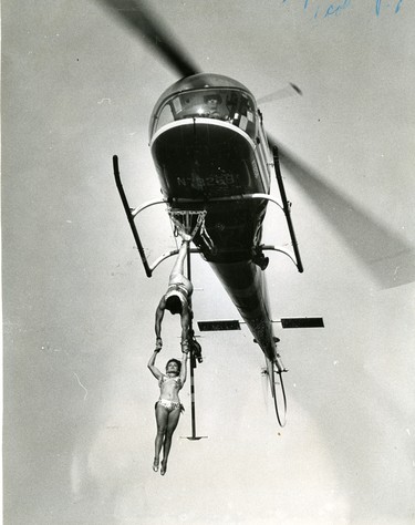 Aerialists: Frank Clark marries Ruthie Engford dangling from a helicopter above Western Fair, 1966. (London Free Press files)