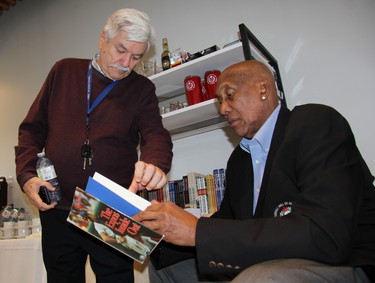 Chatham’s Fergie Jenkins and Carl Kovacs, president of the Fergie Jenkins Foundation, peruse The Expos Inside Out at the renovated Canadian Baseball Hall of Fame and Museum. (Cory Smith/Postmedia Network)