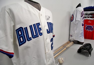 Autographed jerseys and bats are among the artifacts in the Harry Simmons Memorial Library. (Cory Smith/Postmedia Network)