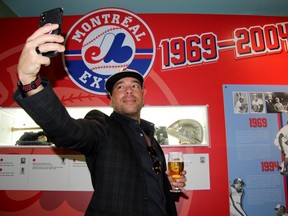Canadian hip hop artist and proclaimed "Expos freedom fighter" Annakin Slayd a takes a selfie in front of a wall honouring the team’s history. (Cory Smith/Postmedia Network)