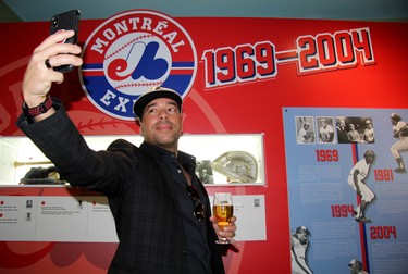 Canadian hip hop artist and proclaimed "Expos freedom fighter" Annakin Slayd a takes a selfie in front of a wall honouring the team’s history. (Cory Smith/Postmedia Network)