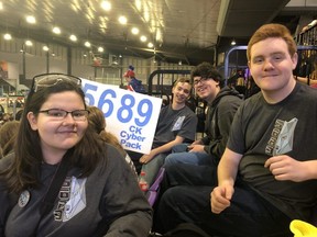 Chatham Kent Cyber Pak members, left to right, Christina Badder, Riley Bates, Joey Voets and Rory Young cheer on their team from the Thompson Arena stands during the FIRST Robotics competition Saturday April 6, 2019.