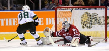 Victor Mete of the Knights scores their only tally of the first period on a powerplay putting a nice pass behind Guelph Storm goalie Liam Herbst Friday night at Budweiser Gardens in London, Ont.  on December 16, 2016.  Mike Hensen/The London Free Press/Postmedia Network