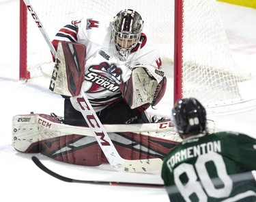 The London Knights' Alex Formenton puts a wrinkle in the sweater of Guelph Storm goalie  Anthony Popvich in the first period of their OHL game at Budweiser Gardens in London, Ont. on Wednesday February 13, 2019. Derek Ruttan/The London Free Press/Postmedia Network