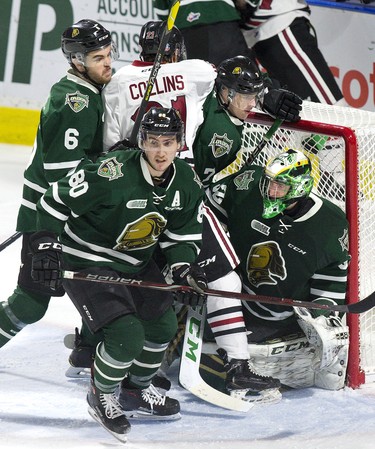 The crease of  London Knights goalie Joseph Raaymakers  gets crowded with teammates Riley Coome (6) Alex Formenton (80), Joey Keane (7) and Ty Collins of the Guelph storm in the second period of their OHL game at Budweiser Gardens in London, Ont. on Wednesday February 13, 2019. Derek Ruttan/The London Free Press/Postmedia Network