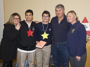 Retired NHL legend Ray Bourque has his photo taken with teachers and students from  St. Thomas' St. Joseph's Catholic High School  L to R Ivanka Furtado, Gabriel Dala, Diego Alban-Gasca, and Diane Silva during the We're All Stars meet and greet portion of the London Sports Celebrity Dinner and Auction. (Derek Ruttan/The London Free Press)