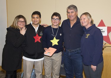 Retired NHL legend Ray Bourque has his photo taken with teachers and students from  St. Thomas' St. Joseph's Catholic High School  L to R Ivanka Furtado, Gabriel Dala, Diego Alban-Gasca, and Diane Silva during the We're All Stars meet and greet portion of the London Sports Celebrity Dinner and Auction. (Derek Ruttan/The London Free Press)