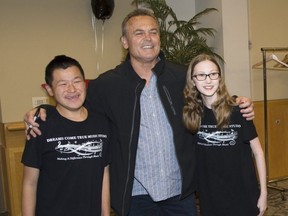 Cameron O'Connor and Emma Dee have their photo taken with former Toronto Blue Jays manager John Gibbons. (Derek Ruttan/The London Free Press)