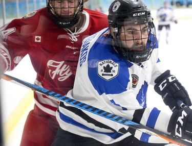 Leamington Flyer Matthew Boring follows London National Nicolas (cct) Hatzikiriakos  into the corner during their game at Western Fairs Sports Centre  in London, Ont. on Wednesday April 3, 2019. Derek Ruttan/The London Free Press/Postmedia Network