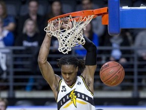 AJ Gaines of the London Lightning dunks against the KW Titans during their NBL playoff game at Budweiser Gardens in London on Thursday. Derek Ruttan/The London Free Press