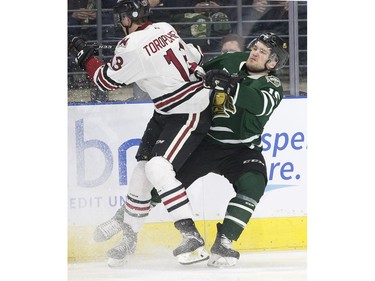 London Knight Cole Tymkin collides with  Alexey Toropchenko of the Guelph Storm in  first period action in Game 1 of their best-of-seven OHL Western Conference semifinal Friday at Budweiser Gardens. (Derek Ruttan/The London Free Press)