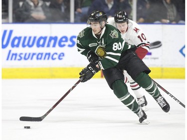 London Knights forward Alex Formenton skates past McKenzie Entwistle of the Guelph Storm during Game 1 of their best-of-seven OHL Western Conference semifinal Friday at Budweiser Gardens. (Derek Ruttan/The London Free Press)