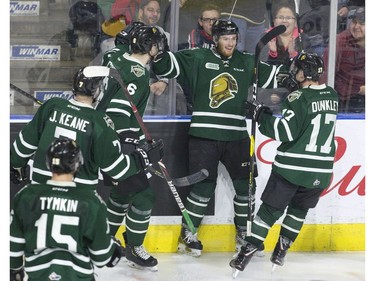 Kevin Hancock celebrates with fellow London Knights after scoring early in the third period to give the team a 3-0 lead against the  Guelph Storm during their OHL playoff game  in London on Sunday. (Derek Ruttan/The London Free Press)