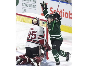 London Knight William Lochead celebrates after scoring on Guelph Storm goalie Nico Daws in the third period of their OHL playoff game in London on Sunday.  (Derek Ruttan/The London Free Press)