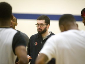 Lightning head coach Elliott Etherington talks to the team during their practice Monday at the Central YMCA. The Lightning continue their playoff series at Budweiser Gardens with Kitchener on Tuesday after dropping game one at home. (Mike Hensen/The London Free Press)