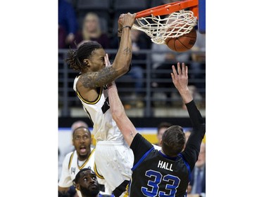 The London Lightning's AJ Gaines gets a face full of fingers from Derek Hall of the Kitchener-Waterloo Titans during their NBL playoff game in London Tuesday April 9, 2019. Derek Ruttan/The London Free Press