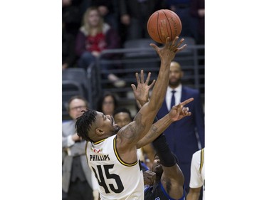 Marvin Phillips of the London Lightning lays up a shot a while covered by Flen Whitfield of the Kitchener Waterloo Titans during their NBL playoff game in London Tuesday April 9, 2019. Derek Ruttan/The London Free Press