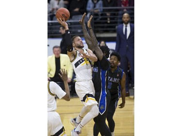 Garrett Williamson of the London Lightning shoots over Akeem Ellis of the Kitchener Waterloo Titans during their NBL playoff game in London Tuesday April 9, 2019. Derek Ruttan/The London Free Press