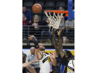 Garrett Williamson of the London Lightning throws up a shot while being defended by Akeem Ellis of the Kitchener Waterloo Titans  during their NBL playoff game in London Tuesday April 9, 2019. Derek Ruttan/The London Free Press