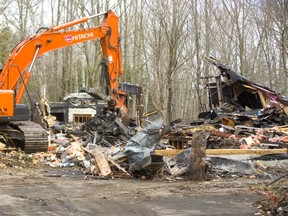 Demolition of the fire-damaged mansion at 4 Aspen Place in Lambeth went quickly on Tuesday April 9, 2019.  An excavator made short work of the damaged structure, which was gutted by fire in August 2017. Mike Hensen/The London Free Press/Postmedia Network