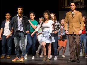 Tyson Simmons, left, as Ren, dances with Helen Danial as Ariel (the preacher’s daughter) and Connor McMullen as Shaw Moore the Preacher in the finale of Footloose at John Paul II Catholic secondary school Tuesday. The school production opens Wednesday and runs to Saturday. (Mike Hensen/The London Free Press)