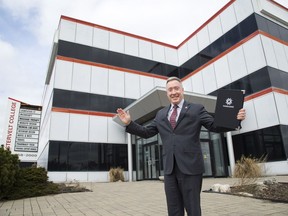 Fanshawe College taking up 37,785 sq. ft. in the former Westervelt College building on Wellington Road, celebrated above by Fanshawe president Peter Devlin, helped push new office space leases in London's suburbs to about 90,000 sq. ft. in 2019's final quarter, realty firm CBRE reports. (Files)