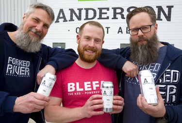 Andrew Peters and Dave Reed, co-owners of London's Forked River brewery, flank Gavin Anderson of Anderson Ale. They are collaborating on a beer that should be available at the start of May. (Mike Hensen/The London Free Press)