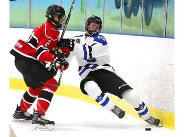 Cohen Kiteley of the London Nationals goes awkwardly into the end boards with Thomas Gangl of the Listowel Cyclones during the first period. The Nationals took advantage of power play goals to lead the Listowel Cyclones 3-0 in the first game of their semifinal at the Western Fair Sports Centre in London on Wednesday. (Mike Hensen/The London Free Press)