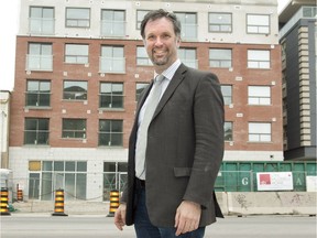 Graham Cubitt, director of projects and development at Indwell, shows one of the group’s projects, an apartment building at 356 Dundas St. in London. (DEREK RUTTAN, The London Free Press)