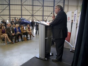 Mayor Ed Holder announces the London Jobs Now task force during a press conference at Diamond Aircraft in London. (Derek Ruttan/The London Free Press)