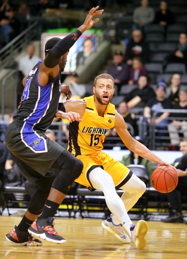 Garrett Williamson is stopped by Flen Whitfield of the Kitchener Waterloo Titans as the Titans dominated in most aspects of the game Sunday at Budweiser Gardens. The Titans won handily, 103-91. Mike Hensen/The London Free Press/Postmedia Network