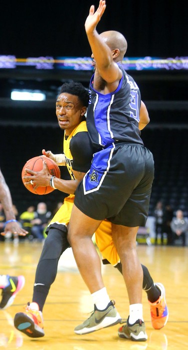 Hometown Bolt Alex Johnson drives into Tramar Sutherland of the Titans in the fifth and final game of their playoff series Sunday, which concluded with a handy 103-91 Kitchener win. The Bolts are out for the season. Mike Hensen/The London Free Press/Postmedia Network