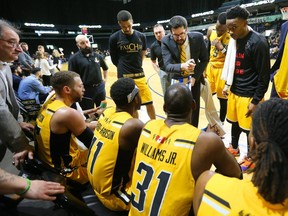 Lightning head coach Elliott Etherington commands the bench's attention during a time out in the fourth quarter of Game 5 against the Kitchener Waterloo Titans at Budweiser Gardens on Sunday, April 14. The Bolts would go on to lose, 109-93, bringing the team's season to an end. (Mike Hensen/The London Free Press)