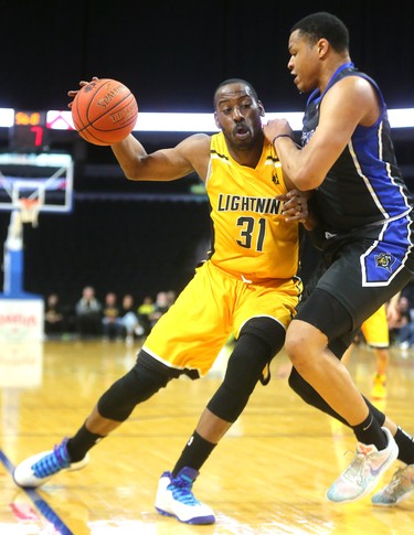 Bolt Kirk Williams Jr. makes little headway against Justin Strings  of the Kitchener Waterloo Titans at Budweiser Gardens on Sunday. London lost 103-91, bringing the team's season to a close. Mike Hensen/The London Free Press/Postmedia Network
