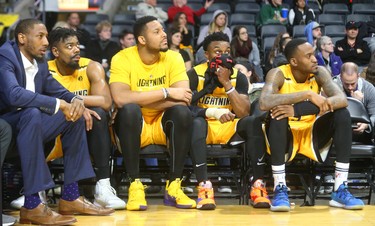 Injured London Lightning player Marcus Capers watches his team fall to the Kitchener Waterloo Titans on Sunday. Marvin Phillips watches the clock with Alex Johnson, Rudolphe Joly and Kevin Ware Jr. late in the 5th and final game of the team's playoff series against Kitchenerat Budweiser Gardens. The Bolts lost 103-91 ending the team's season,Mike Hensen/The London Free Press/Postmedia Network