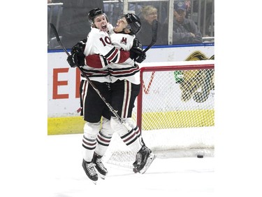 Guelph Storm players MacKenzie Entwistle (left) and Nick Suzuki jump for joy after Entwistle's empty net goal cemented a 6-3 victory over the London Knights in London, Ont. on Tuesday April 16, 2019. Derek Ruttan/The London Free Press/Postmedia Network