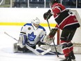 London Nationals goalie Zachary Springer stops a shot while Listowel Cyclones forward Rylan Bowers looks to pounce on a rebound during the first period of their game in London, Ont. on Wednesday April 17, 2019. (Derek Ruttan/The London Free Press)