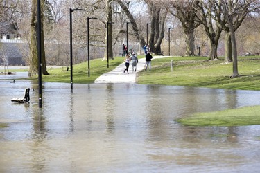People were forced to take a detour from the path in Harris Park due to  flooding from the Thames River in London, Ont. on Sunday April 21, 2019. Derek Ruttan/The London Free Press/Postmedia Network