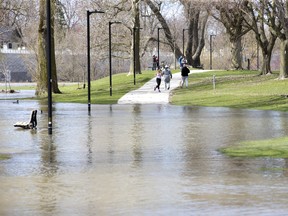 People were forced to take a detour from the path in Harris Park due to  flooding from the Thames River in London, Ont. on Sunday April 21, 2019. Derek Ruttan/The London Free Press/Postmedia Network