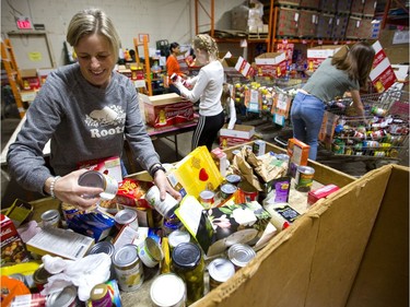 Teacher Cathy Clarke uses her day off to help sort donations as the London Food Bank wraps up its spring food drive on Easter Monday. The drive drew more than 21.600 kgs of food this year, with some donations collected at large grocery stores still to be counted. (Mike Hensen/The London Free Press)