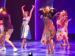 Katie Kerr of Windsor, centre, debuts on the Grand Theatre's Spriet stage in the role of Sophie in Mamma Mia! during a media call in London on Tuesday  for the last show of the 2018-2019 season. (Mike Hensen/The London Free Press)