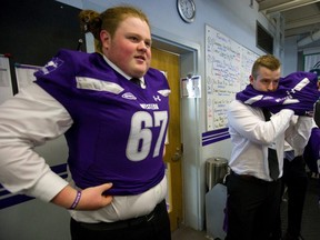 South Secondary's offensive lineman Matt Adams was the first to get a purple jersey as the recruiting class of 2019 was unveiled at TD stadium, next to him is Craig Coleman of Parkside. Mike Hensen/The London Free Press/Postmedia Network