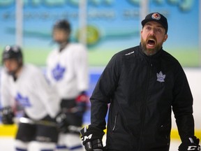 London Nationals head coach Pat Powers shouts instructions during a drill at practice. (Mike Hensen/The London Free Press)