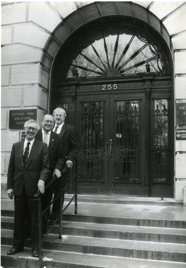 London Life corporate executives in front of Dufferin Avenue building. Shown from bottom L. Blake Fewster (senior vice-president & Chief Actuary), John P. Ferris (manager/operations corporate Actuarial) and top Jim G. Etherington (Vice-president Corporate Affairs), 1991. (London Free Press files)