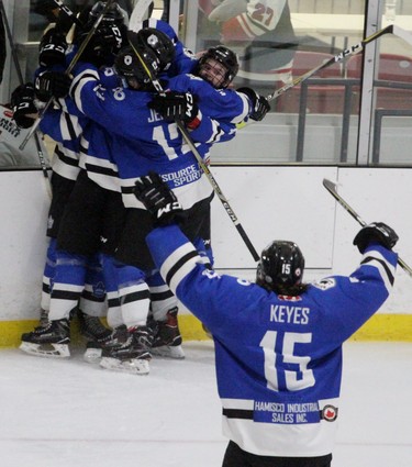 London Nationals players celebrate Josh Castle's overtime goal that gave his team a 3-2 win and 3-1 series lead. (Cory Smith, Postmedia Network)
