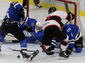 Listowel's Brayden Krieger nearly scored in overtime but was thwarted by a trio of London Nationals, including goalie Zachary Springer. (Cory Smith, Postmedia Network)