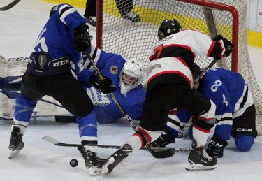 Listowel's Brayden Krieger nearly scored in overtime but was thwarted by a trio of London Nationals, including goalie Zachary Springer. (Cory Smith, Postmedia Network)