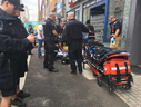 Emergency crews attend to a man who suffered a suspected drug overdose on Dundas Street near Richmond Street Tuesday afternoon,  April 30, 2019. (Derek Ruttan/The London Free Press)