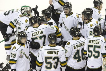 London Knights hug after losing 7-2 to the Guelph Storm  eliminating them from the Memorial Cup in London, Ont. on Tuesday May 21, 2014. DEREK RUTTAN/London Free Press/QMI Agency