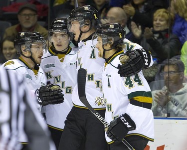 Michael McCarron celebrates his first goal of the game for the Knights with Max Domi, Aiden Jamieson and Dakota Mermis during their Thursday night game against the Guelph Storm at Budweiser Gardens in London, Ont. on Thursday November 6, 2014.  Mike Hensen/The London Free Press/QMI Agency